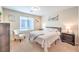 Inviting bedroom with plush bedding, soft lighting, and a comfortable reading nook at 4212 Juanita May Ave, North Las Vegas, NV 89032