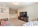 Bonus room with TV, seating, neutral wall color, carpet and access to upstairs at 4212 Juanita May Ave, North Las Vegas, NV 89032