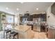 Bright kitchen features dark cabinets, stainless steel appliances and large granite island at 4212 Juanita May Ave, North Las Vegas, NV 89032