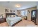 Comfortable bedroom featuring stylish décor, soft carpet, and a calming color palette at 4212 Juanita May Ave, North Las Vegas, NV 89032