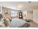 Well-lit bedroom with large mirror and a view into the en-suite bathroom at 4212 Juanita May Ave, North Las Vegas, NV 89032