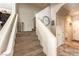 Staircase leading upstairs with carpet steps, white walls, and access to other rooms at 4212 Juanita May Ave, North Las Vegas, NV 89032