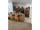 Kitchen with wood cabinetry, a breakfast bar, and modern appliances at 425 Ross Ave, Overton, NV 89040