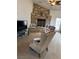 Cozy living room with a stone fireplace, comfortable seating, and natural light at 425 Ross Ave, Overton, NV 89040