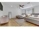 Well-lit bedroom featuring two beds, a ceiling fan, and hardwood flooring at 4330 Flandes St, Las Vegas, NV 89121