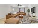Spacious living room featuring a plush sectional, stylish decor, and abundant natural light at 4330 Flandes St, Las Vegas, NV 89121
