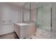 Sleek bathroom with double sinks, marble floors, a frosted glass shower, and contemporary design at 4575 Dean Martin Dr # 2607, Las Vegas, NV 89103
