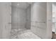 Modern bathroom with a glass-enclosed shower, marble floors, and minimalist design at 4575 Dean Martin Dr # 2607, Las Vegas, NV 89103