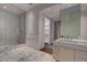 Elegant bathroom with marble floors, dual vanity, and large walk-in glass shower at 4575 Dean Martin Dr # 2607, Las Vegas, NV 89103