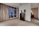 Bedroom featuring a large window, neutral decor, and ample natural light at 4575 Dean Martin Dr # 2607, Las Vegas, NV 89103