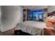Bright bedroom features a large window with a captivating city view, complemented by simple decor at 4575 Dean Martin Dr # 2607, Las Vegas, NV 89103