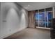 Bedroom with a large window and a dark dresser with ample sunlight creating an inviting atmosphere at 4575 Dean Martin Dr # 2607, Las Vegas, NV 89103