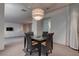 Chic dining room is enhanced by a modern light fixture and seating for four at 4575 Dean Martin Dr # 2607, Las Vegas, NV 89103