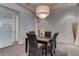Chic dining room is enhanced by a modern light fixture and seating for four at 4575 Dean Martin Dr # 2607, Las Vegas, NV 89103