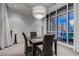 Cozy dining room with elegant lighting and city views through large windows with sheer curtains at 4575 Dean Martin Dr # 2607, Las Vegas, NV 89103