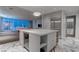 Modern kitchen with stainless steel appliances, wine cooler, marble floors, and open city views at 4575 Dean Martin Dr # 2607, Las Vegas, NV 89103
