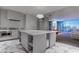 Modern kitchen features a spacious island, stainless steel appliances, sleek cabinetry, and beautiful marble flooring at 4575 Dean Martin Dr # 2607, Las Vegas, NV 89103