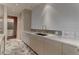 Contemporary kitchen with a long countertop, integrated sink, and sleek cabinetry with ample storage at 4575 Dean Martin Dr # 2607, Las Vegas, NV 89103