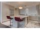 Modern kitchen featuring a large island with seating, stainless steel appliances, and stylish marble flooring at 4575 Dean Martin Dr # 2607, Las Vegas, NV 89103