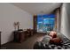 A sophisticated living area features a beautiful desk space and cityscape view at 4575 Dean Martin Dr # 2607, Las Vegas, NV 89103