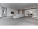 Open-concept living room with a large sofa, a TV, and access to the kitchen at 4575 Dean Martin Dr # 2607, Las Vegas, NV 89103