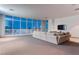 Spacious living room with floor-to-ceiling windows offering stunning city views at 4575 Dean Martin Dr # 2607, Las Vegas, NV 89103