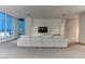 Bright, spacious living room featuring neutral tones and stunning city views at 4575 Dean Martin Dr # 2607, Las Vegas, NV 89103