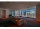 Spacious living room with large windows offering a stunning city view and comfortable seating arrangement at 4575 Dean Martin Dr # 2607, Las Vegas, NV 89103