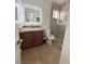 Bathroom with tile flooring, granite countertop, and shower with glass door at 5040 Jacarilla Ln, North Las Vegas, NV 89031