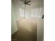 Well-lit bedroom with a ceiling fan and neutral carpet flooring at 5040 Jacarilla Ln, North Las Vegas, NV 89031