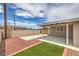 Great outdoor space featuring a covered patio and well maintained lawn area at 5203 Treasure Ave, Las Vegas, NV 89122