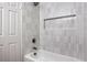 Bright bathroom showcasing a bathtub with white subway tiles, a niche, and modern fixtures at 5203 Treasure Ave, Las Vegas, NV 89122