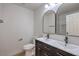 Bathroom featuring a modern dual sink vanity and updated fixtures at 5203 Treasure Ave, Las Vegas, NV 89122