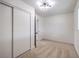 This spacious bedroom is complete with modern lighting, plush carpeting, and an ensuite bath at 5203 Treasure Ave, Las Vegas, NV 89122