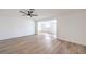 Spacious living room with hardwood floors leading to an adjacent room at 5203 Treasure Ave, Las Vegas, NV 89122