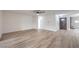 Bright and airy living room with wood floors, ceiling fan and neutral paint color, perfect for relaxing at 5203 Treasure Ave, Las Vegas, NV 89122