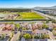 Neighborhood aerial view showcasing well-maintained homes, desert landscape, and mountain views at 5232 Pendergrass St, North Las Vegas, NV 89081