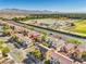Aerial view showing well-maintained homes, lush landscaping, and proximity to nearby amenities at 5232 Pendergrass St, North Las Vegas, NV 89081