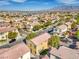 Expansive aerial view of a community with uniform architecture and well-kept landscaping at 5232 Pendergrass St, North Las Vegas, NV 89081