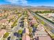 A wide aerial view of a suburban neighborhood, showcasing consistent architectural styles and organized street layouts at 5232 Pendergrass St, North Las Vegas, NV 89081