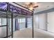 Comfortable bedroom featuring carpet, a lofted bed, a ceiling fan, and sliding closet doors at 5232 Pendergrass St, North Las Vegas, NV 89081
