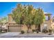 Inviting home featuring desert landscaping with a large tree offering shade and curb appeal at 5232 Pendergrass St, North Las Vegas, NV 89081