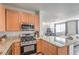 Well-lit kitchen featuring stainless steel appliances and granite countertops at 5232 Pendergrass St, North Las Vegas, NV 89081