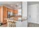 Updated kitchen featuring granite countertops, stainless steel appliances, and breakfast bar at 5232 Pendergrass St, North Las Vegas, NV 89081