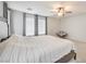 Comfortable main bedroom with soft lighting, a ceiling fan, and tranquil decor at 5232 Pendergrass St, North Las Vegas, NV 89081