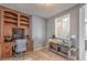 Home office with a built-in desk and shelving, complemented by a unique aquarium feature at 5232 Pendergrass St, North Las Vegas, NV 89081