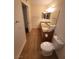 Bright bathroom with double sinks, granite counters, tile floor, and toilet at 5710 E Tropicana Ave # 1172, Las Vegas, NV 89122