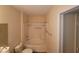 Bathroom featuring a tub shower with safety bars and toilet at 5710 E Tropicana Ave # 1172, Las Vegas, NV 89122