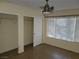 Bright bedroom with a ceiling fan and closet space at 5710 E Tropicana Ave # 1172, Las Vegas, NV 89122