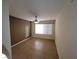 Bright bedroom with tile floors, neutral walls, and a ceiling fan at 5710 E Tropicana Ave # 1172, Las Vegas, NV 89122